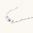 Sterling silver multi-strand necklace with three brushed round beads on cream background